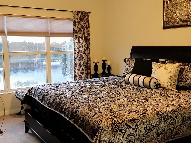Lakeview master bedroom with king bed