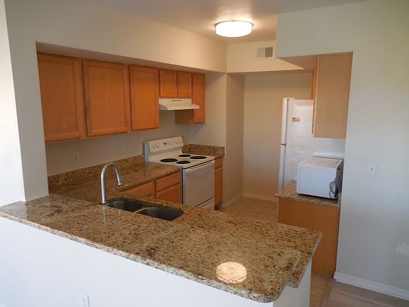 New lighting in granite kitchen. New granite breakfast bar.
