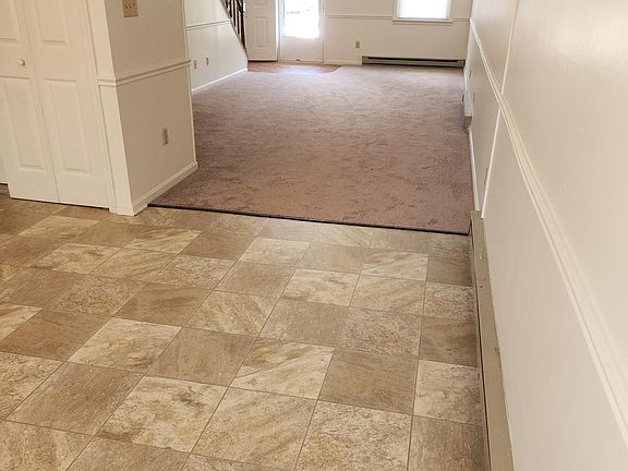 View of kitchen looking through living room