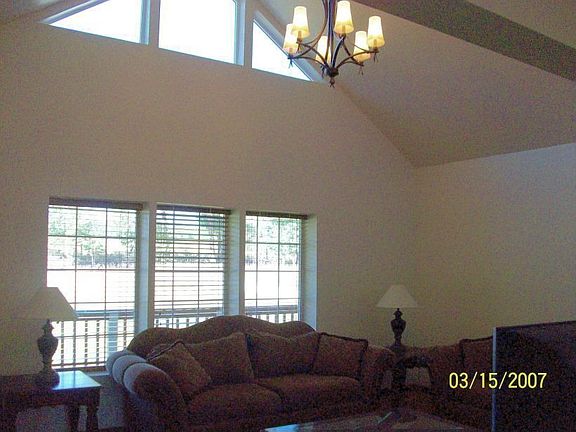 Lots of light with windows and vaulted ceilings in living room