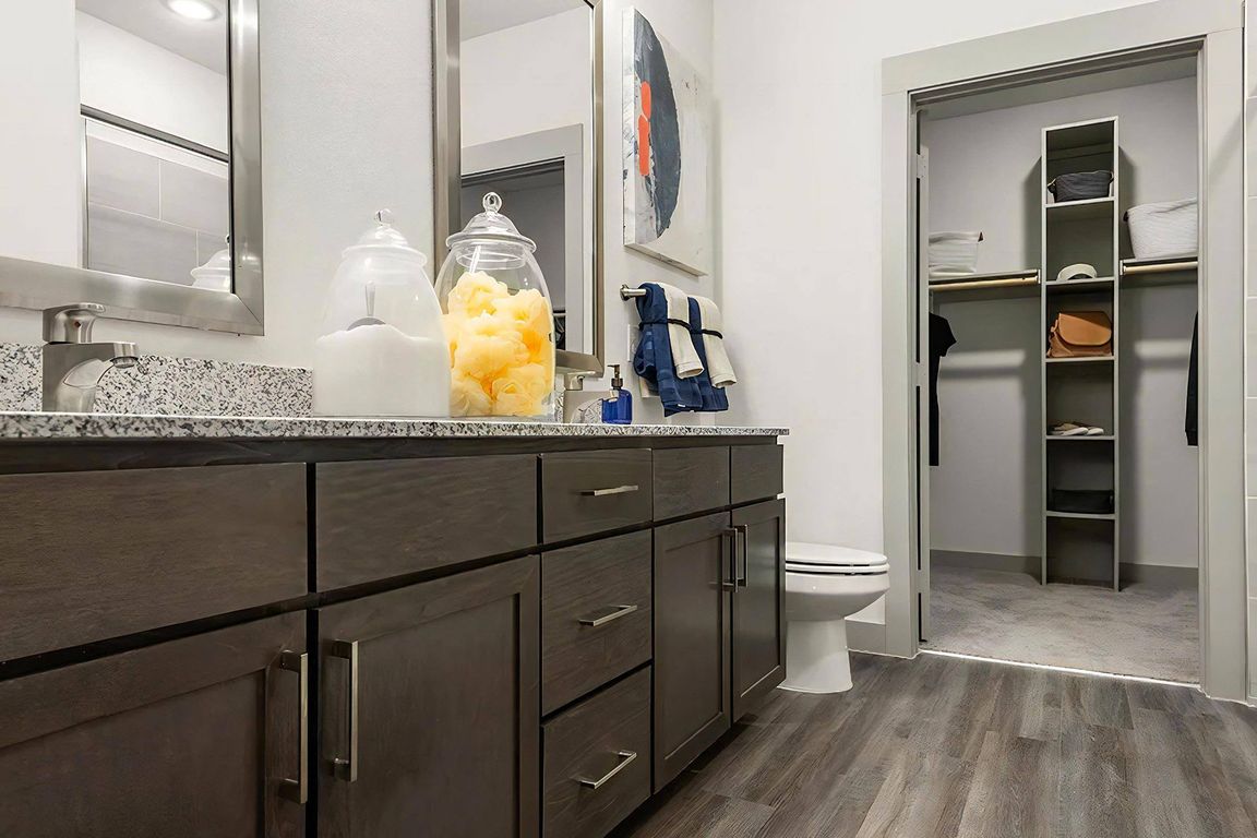 Spacious Bathroom Featuring Two Separate Mirrors Above Vanities
