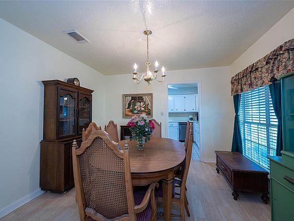 Formal dining room leads to kitchen.