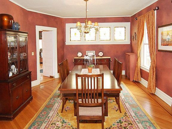 FORMAL DINING ROOM WITH STAINED GLASS TRANSOM WINDOWS