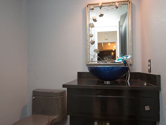 Gorgeous vessel sink and fixtures in the downstairs powder bath.