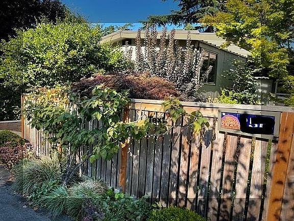 Serene Mid-Century Modern Home (featured in 1954 Seattle Times!) behind the fence. Come in...