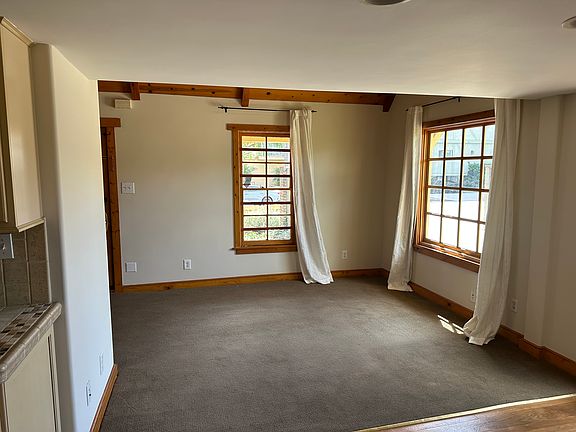 Living room, west facing window on right and south facing window on left side.