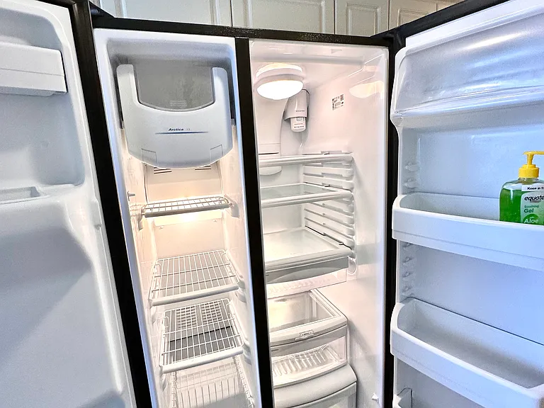 Sleek, spacious, and sparkling clean. _ We know a great kitchen starts with a great fridge. Enjoy the convenience of our large side-by-side unit_perfect for keeping all your local Florida finds fresh and organized during your vacation.