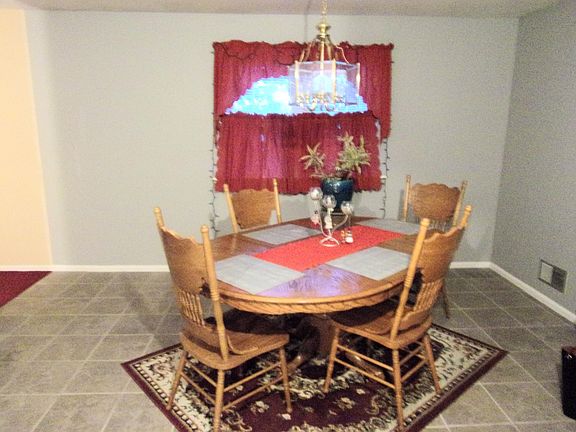 Dining area with ceramic tile floor