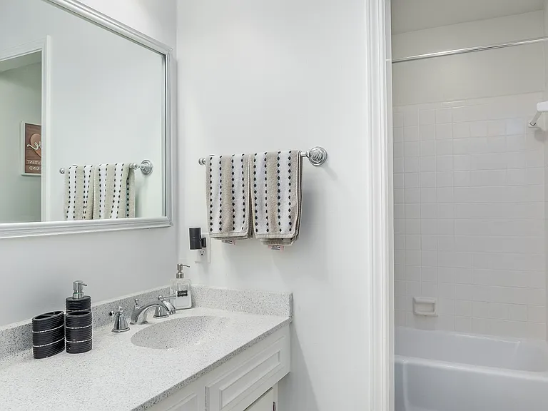 Second bathroom with detachable shower head with adjustable sprayer