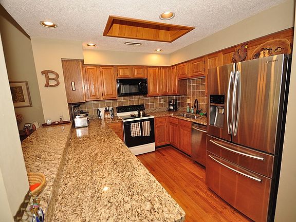 granite, stainless and wood floors