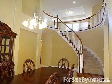 Formal Dining
						:
						Curved staircase adds beauty to the entryway and formal dining area