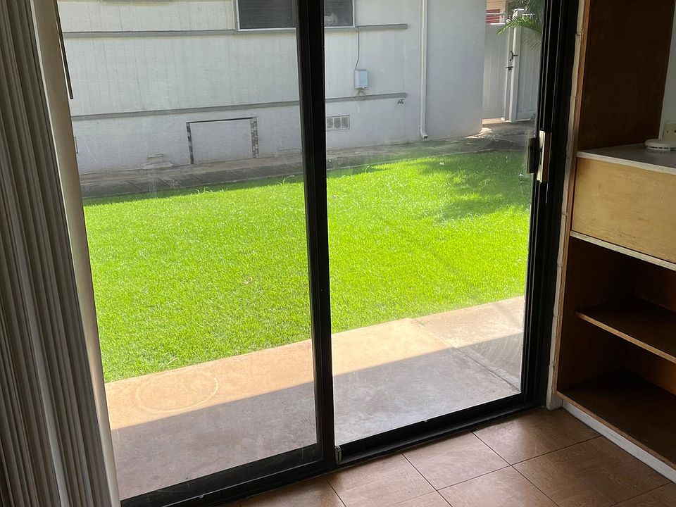 Lovely greenery from living room. Sliding glass door opens to yard