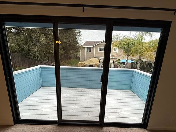 Patio outside the main living area and overlooking the backyard