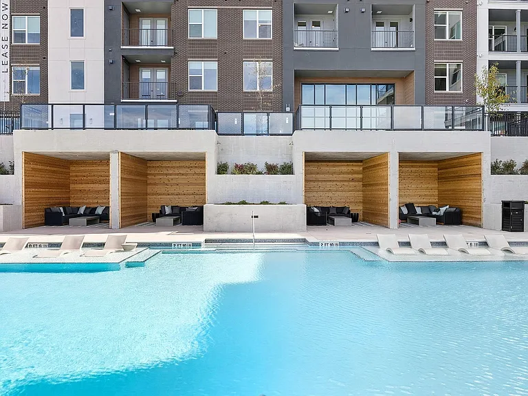 Relax poolside in the shaded cabanas
