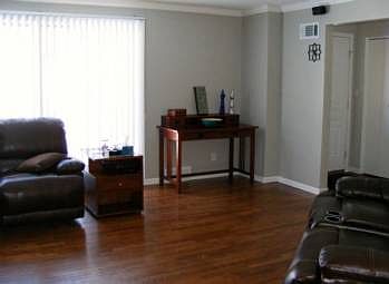 A newly refinished hardwood floor and wonderful window make the room both beautiful and a worry free space for entertaining.
