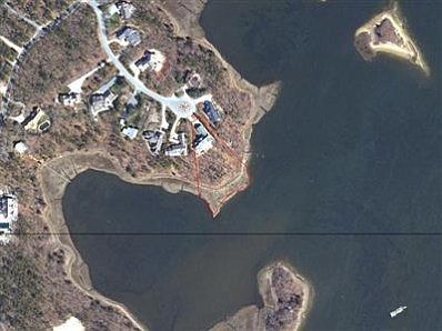 Aerial view shows the lot that ends at the water