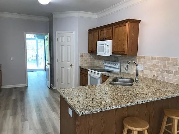 View of kitchen with walk-in pantry - door to office