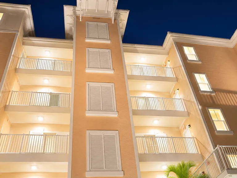 Beautifully illuminated exterior showcasing the rear facade building at night