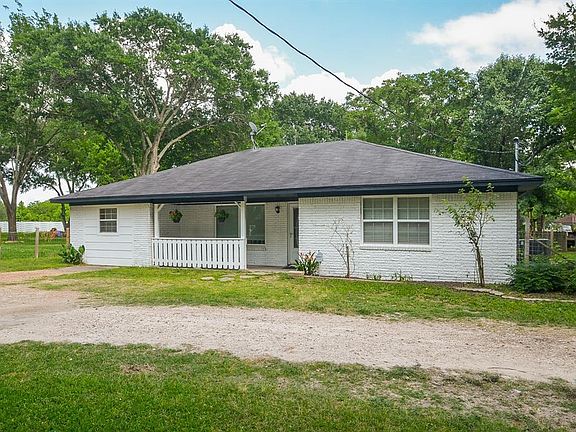 This charming front porch is a perfect spot for your morning coffee or sun-loving flowers!