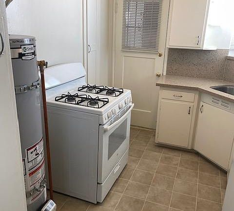 Gas range with own water heater.