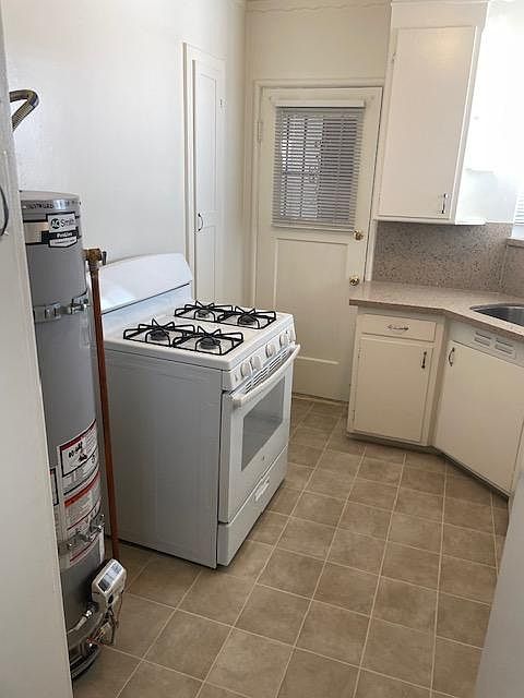 Gas range with own water heater.