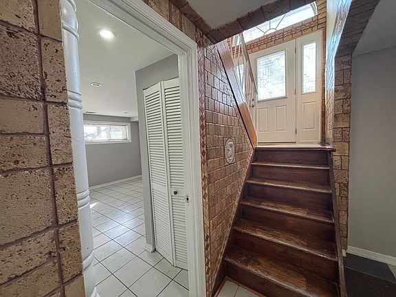 Main entrance showing the split level and one of the rooms that could be used as an office.