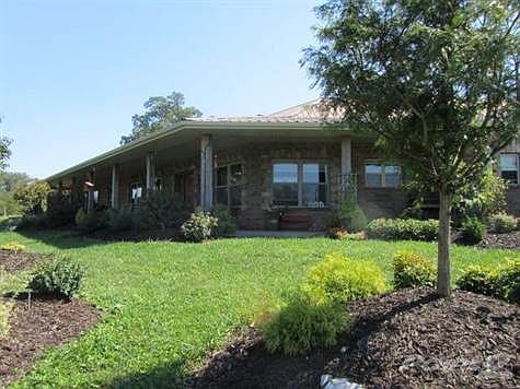 Front view of home surrounded by beautiful landscaping