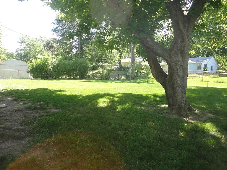 Large, fenced backyard with patio.