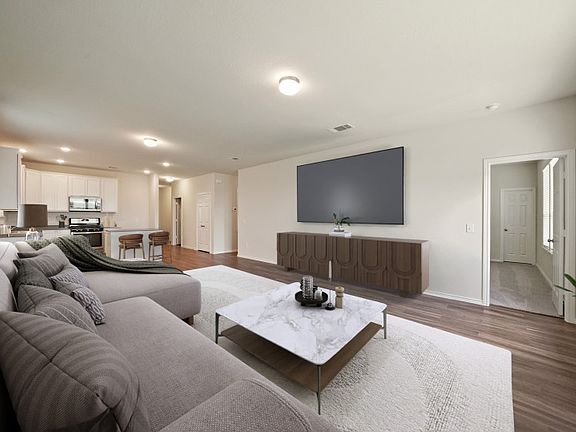 Airy gathering room showcases open concept floorplan