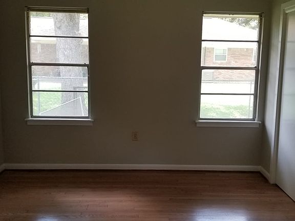 Bedroom with wood floors