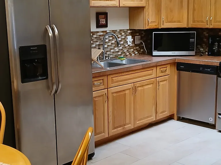 A veiw of the kitchen from the dining area.