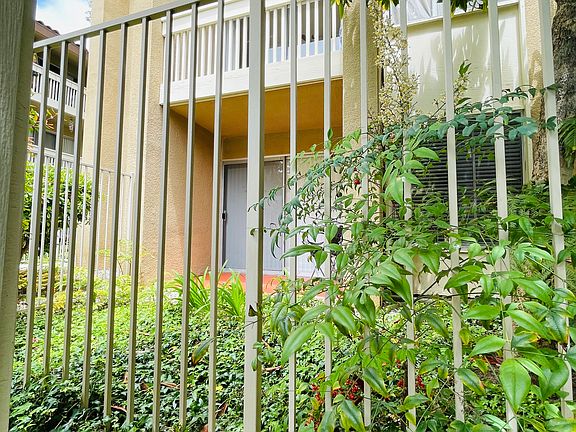 view of condo from the pool