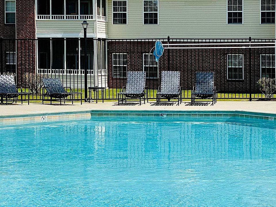 Capture the essence of outdoor living with another view of our expansive pool area and sundeck, designed for your leisurely moments and summer fun.