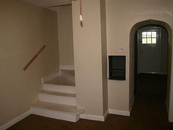 Staircase and entry beyond