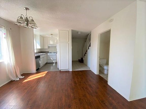 Spacious living room with downstairs bathroom.