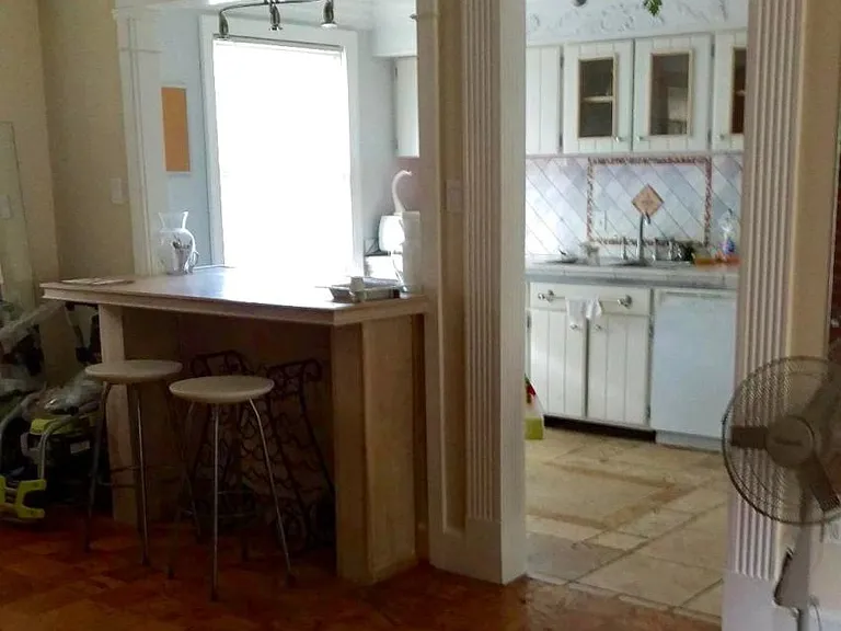 open living area to kitchen