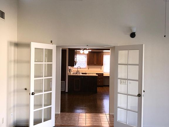 Livingroom view towards kitchen and dining area