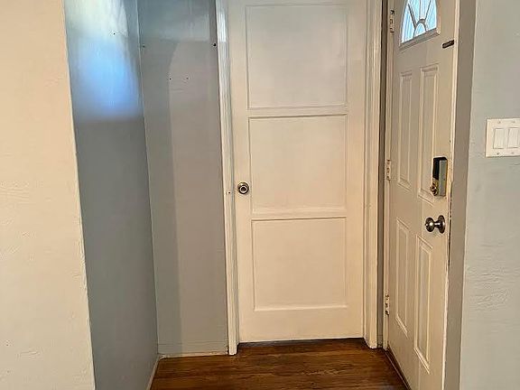 Front door, hallway to the first door that enters the first bedroom