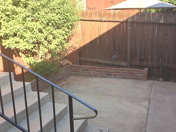 private fenced front yard