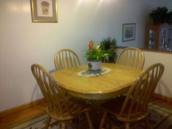 It also includes a Lovely Dining Room with Hardwood Floors, which overlooks a Sunken Living Room.