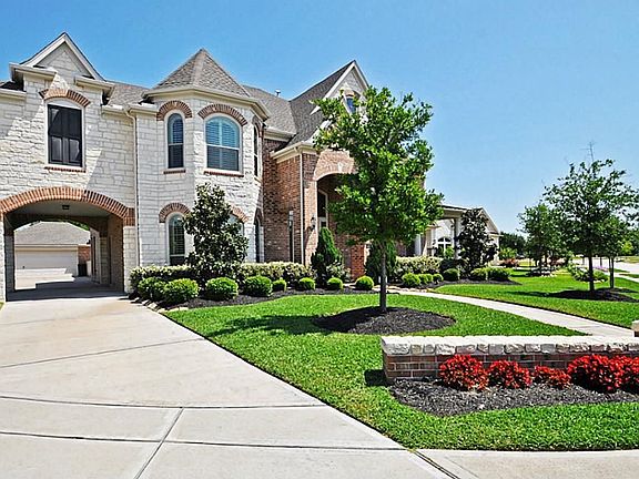 Check out all that upgraded stone work and Porte-cochere