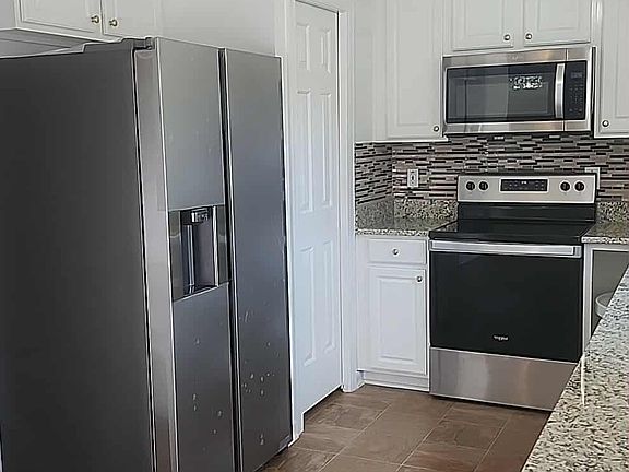Kitchen with its appliances.