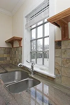Granite Counter / Tiled Backsplash & Windowed Sink