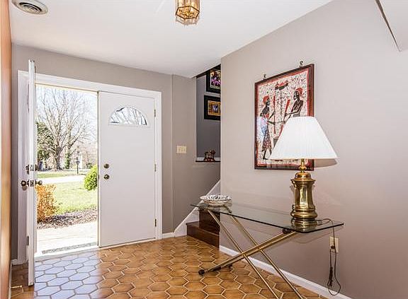 Welcoming and spacious entry foyer with tile floor