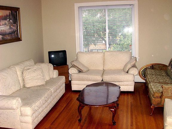 Large living room for plenty of seating/entertaining. 2 walls w/ windows.