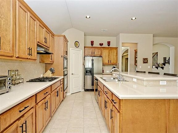 Plenty of counter space and a large pantry for storage. There is also a breakfast bar that seats up to three!