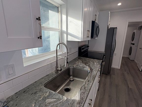 Ocean Fantasy Granite on the countertop, large sink, Microhood, Electric range and full size 36 inch refreigerator