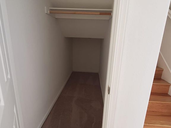 walk in coat closet with lots of storage