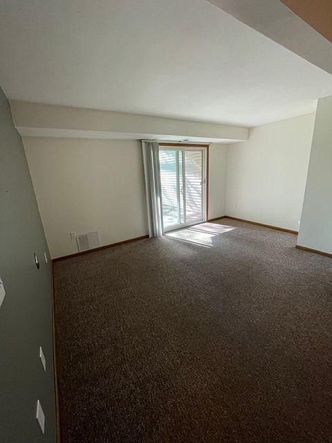 Living room with patio access.
