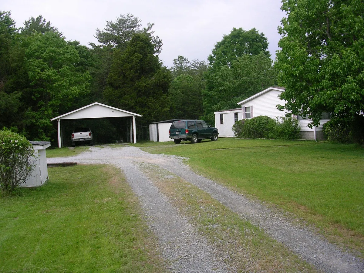Driveway with view of carport and utility shed - Buffalo Heights Rd